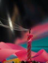 Birthday candles that have just been blown out with smoke on color background Royalty Free Stock Photo