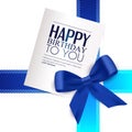 Birthday card with blue ribbon and birthday text. Royalty Free Stock Photo