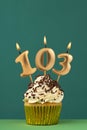 Birthday card with candle number 103 - Green background