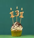Birthday card with candle number 131 - Green background