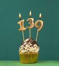 Birthday card with candle number 139 - Green background Royalty Free Stock Photo