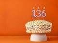 Birthday card with candle number 136 - Vanilla cake in orange background