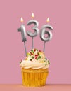 Birthday card with cupcake and candle number 136