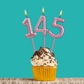 Birthday card with number 145 candle on aquamarine background