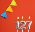 Birthday card - Number 127 candle in orange background