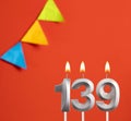 Birthday card - Number 139 candle in red background Royalty Free Stock Photo