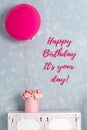 Birthday card. Postcard with words It is your day. One big pink balloon and flower box.
