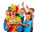 Birthday child clown eating cake with boy together. Kid with messy face. Royalty Free Stock Photo