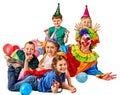 Birthday child clown playing with children. Kid holiday cakes celebratory.