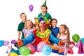 Birthday child clown playing with children. Kid holiday cakes celebratory.