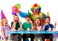 Birthday child clown playing with children. Kid holiday cakes celebratory.