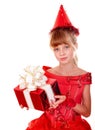 Birthday child girl in red dress with gift box.