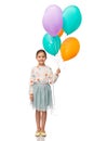 happy girl in birthday party hat with balloons Royalty Free Stock Photo