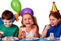 Birthday children celebrate party and eating cake on plate together . Royalty Free Stock Photo