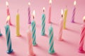 birthday coloured candles arranged on a pink background Royalty Free Stock Photo