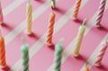 birthday coloured candles arranged on a pink background Royalty Free Stock Photo