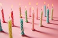 birthday coloured candles arranged on a pink background Royalty Free Stock Photo
