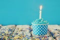 Birthday concept with cupcake and candle on wooden table Royalty Free Stock Photo