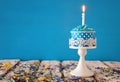 Birthday concept with cupcake and candle on wooden table Royalty Free Stock Photo