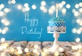 Birthday concept with cupcake and candle on wooden table Royalty Free Stock Photo