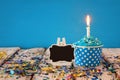Birthday concept with cupcake and candle on wooden table Royalty Free Stock Photo