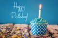 Birthday concept with cupcake and candle on wooden table Royalty Free Stock Photo