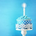 Birthday concept with cupcake and one candle on wooden table Royalty Free Stock Photo