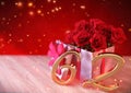 Birthday concept with red roses in gift on wooden desk. sixty-second. 62nd. 3D render