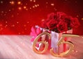 Birthday concept with red roses in gift on wooden desk. sixtyfifth. 65th. 3D render
