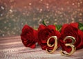 Birthday concept with red roses on wooden desk. ninety-third. 93rd. 3D render Royalty Free Stock Photo
