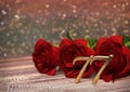 Birthday concept with red roses on wooden desk. seventy-seventh. 77th. 3D render