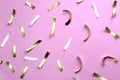 Texture festive confetti scattered on lilac background