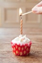Birthday cupcake blurry background candle lit Royalty Free Stock Photo