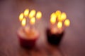 Birthday cupcake blurry background with lots of lit candles Royalty Free Stock Photo