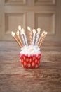 Birthday cupcake blurry background with lots of lit candles Royalty Free Stock Photo