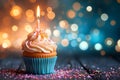 Birthday cupcake, burning candle, bokeh lights background, festive celebration