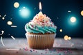 Birthday cupcake with burning candle, closeup, light background