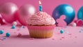 birthday cupcake with candle A cute and festive photo of a pink birthday cupcake with a single candle on top. Royalty Free Stock Photo