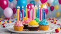 birthday cupcake with candles A realistic scene of colorful happy birthday cupcakes with candles Royalty Free Stock Photo