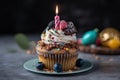 Birthday cupcake with chocolate frosting and candles, selective focus, A Happy birthday cupcake with so many sweet toppings and