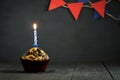 Birthday cupcake on a dark background. Happy Birthday. Postcard. Congratulations.