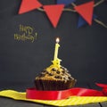 Birthday cupcake on a dark background. Happy Birthday. Postcard. Congratulations.