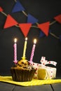 Birthday cupcake on a dark background. Happy Birthday. Postcard. Congratulations.