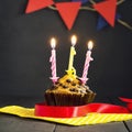 Birthday cupcake on a dark background. Happy Birthday. Postcard. Congratulations.