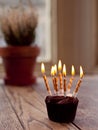 Birthday cupcake with lots of lit candles Royalty Free Stock Photo