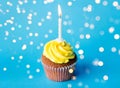 Birthday cupcake with one burning candle Royalty Free Stock Photo