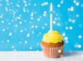 Birthday cupcake with one burning candle Royalty Free Stock Photo