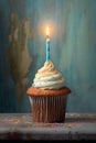 birthday cupcake with a single lit candle Royalty Free Stock Photo