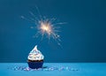 Birthday Cupcake on blue with sparkler Royalty Free Stock Photo