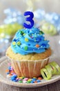 Birthday cupcake for a 3 year old Royalty Free Stock Photo